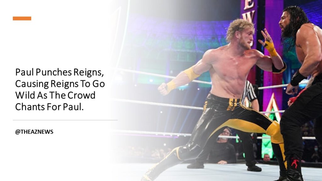 Paul Punches Reigns, Causing Reigns To Go Wild As The Crowd Chants For Paul.